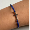Adjustable cord bracelet with a cross