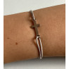 Adjustable cord bracelet with a cross